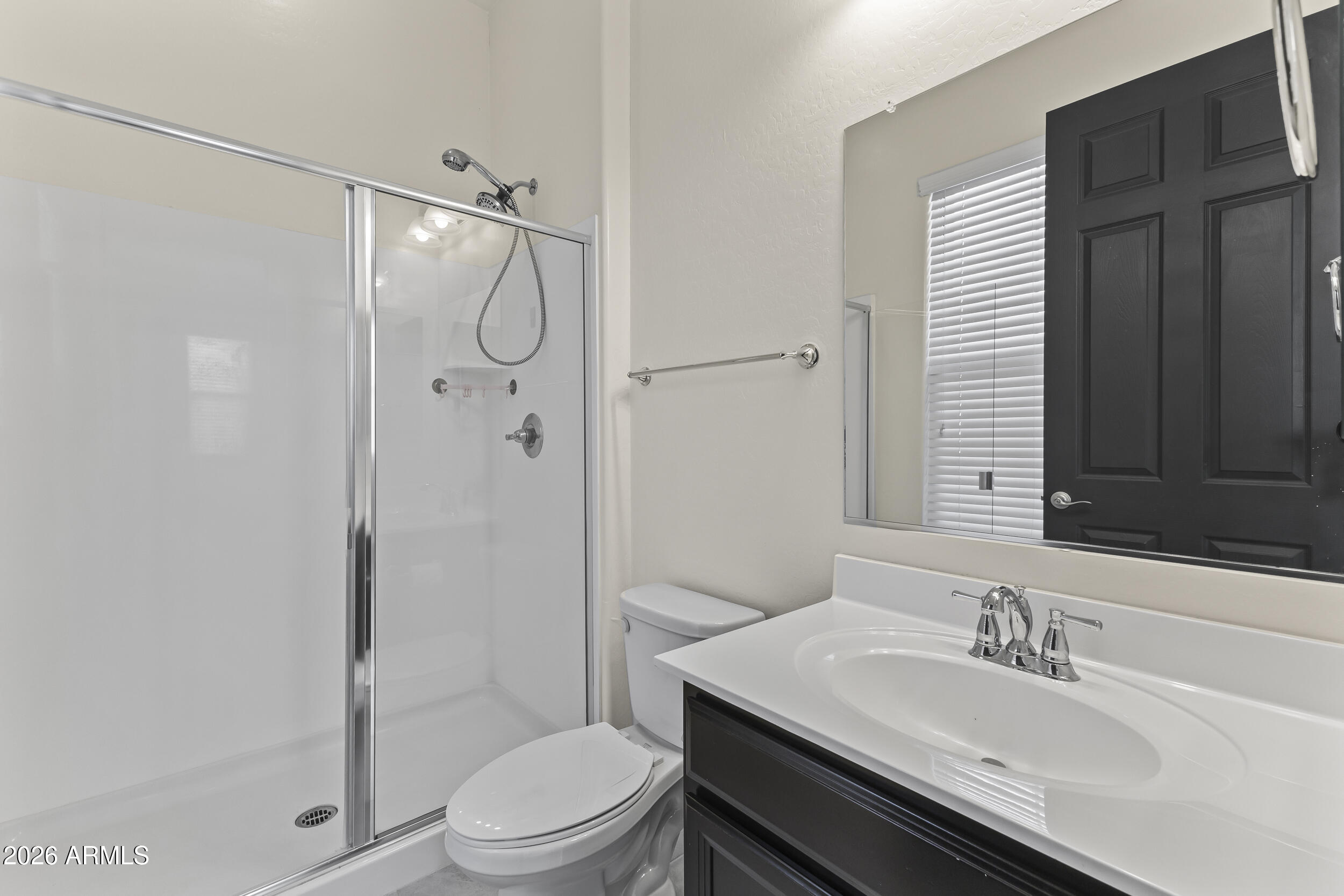 5255 North Ginning Road Litchfield Park, AZ 85340 - Photo 10 of 60 a bathroom with a granite countertop sink toilet and shower