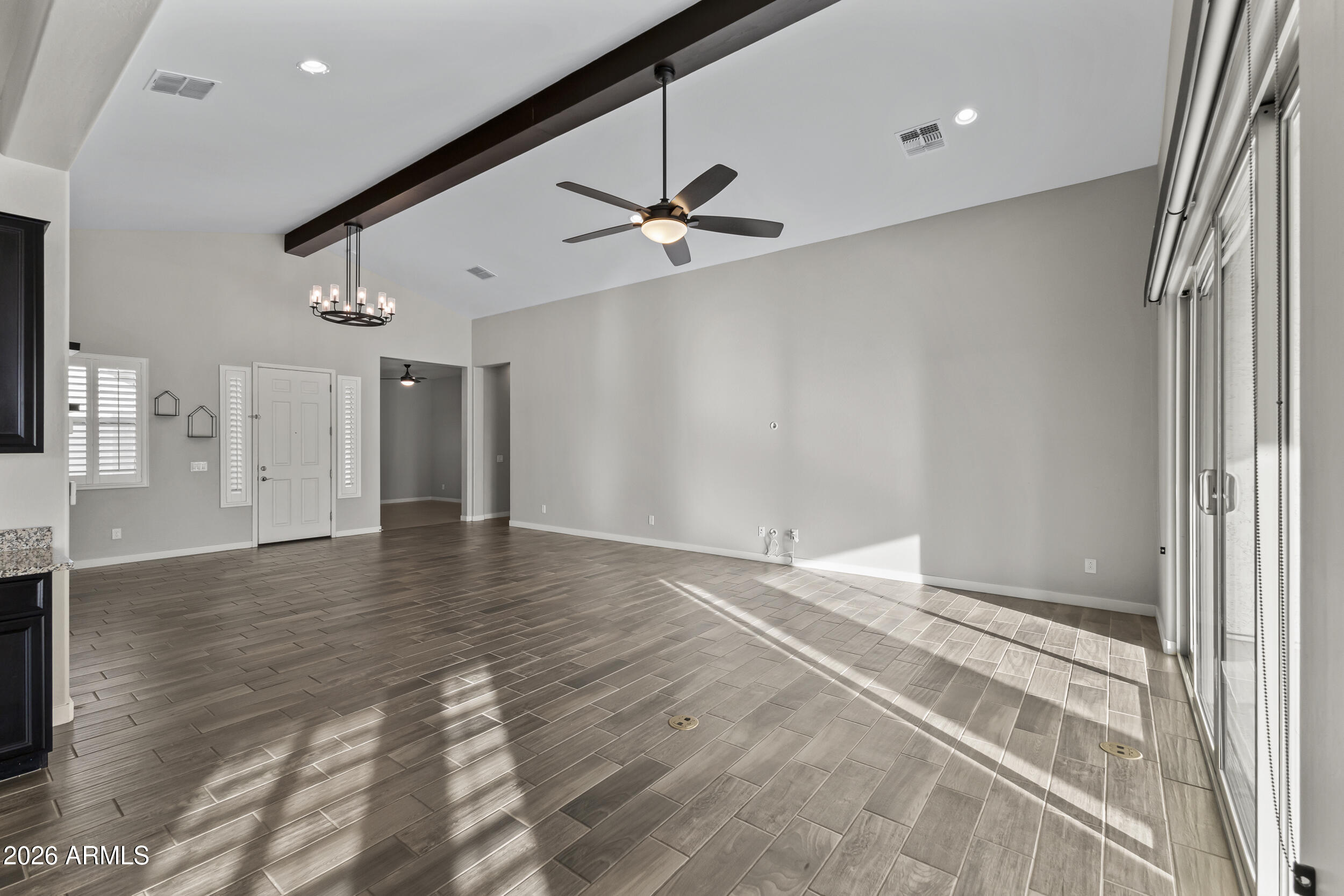 5255 North Ginning Road Litchfield Park, AZ 85340 - Photo 17 of 60 wooden floor in an empty room with a window