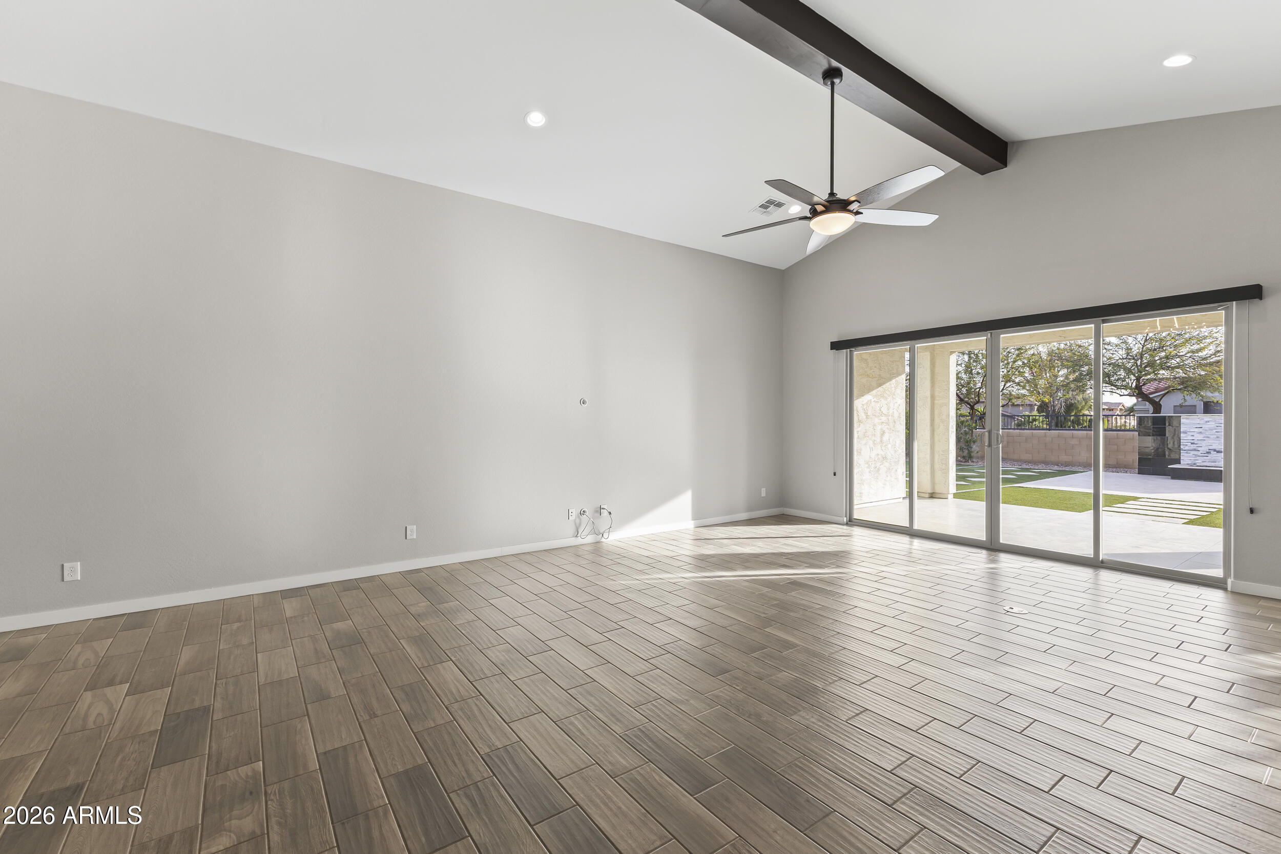 5255 North Ginning Road Litchfield Park, AZ 85340 - Photo 19 of 60 wooden floor in an empty room with a window