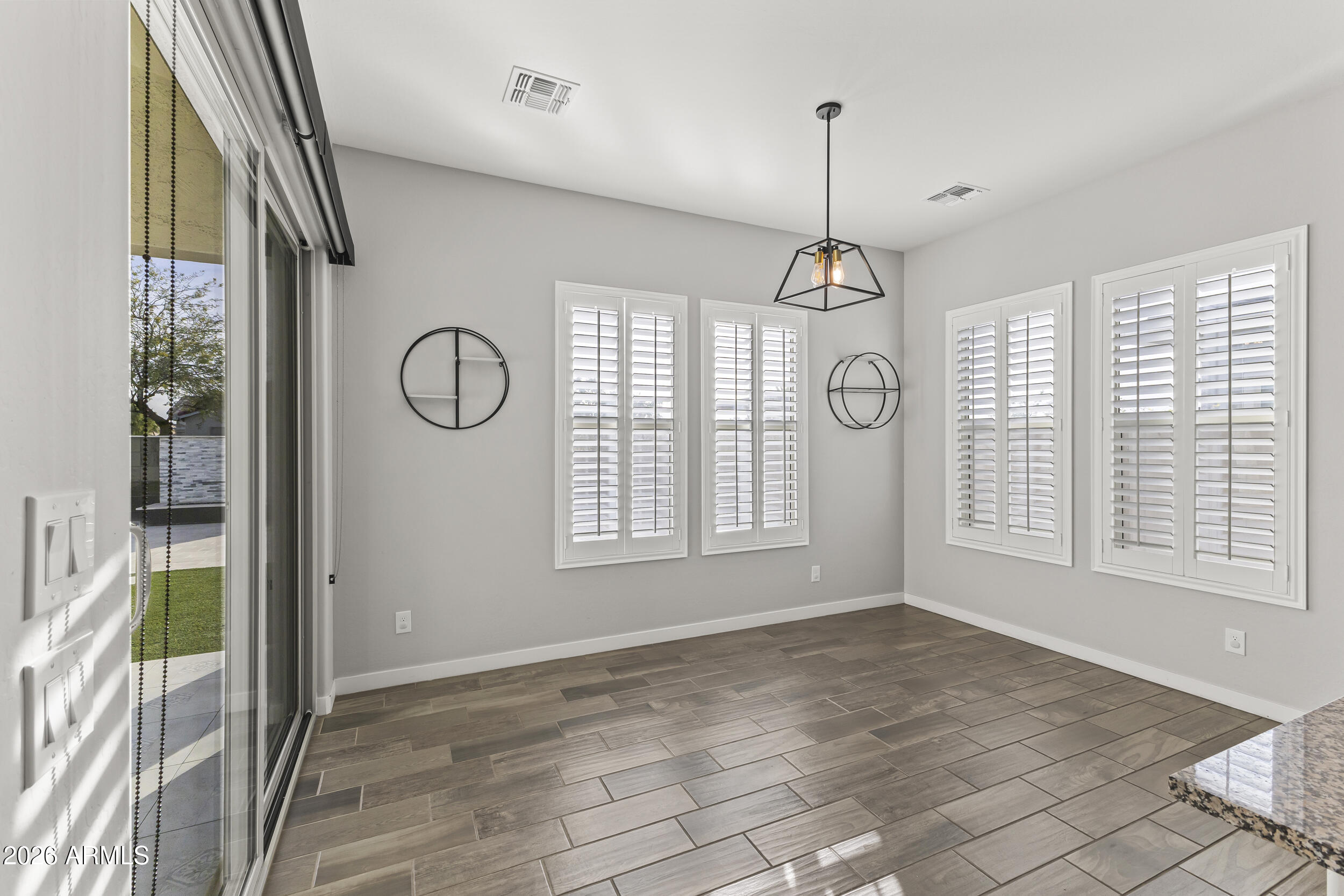 5255 North Ginning Road Litchfield Park, AZ 85340 - Photo 23 of 60 a view of an room with wooden floor and windows