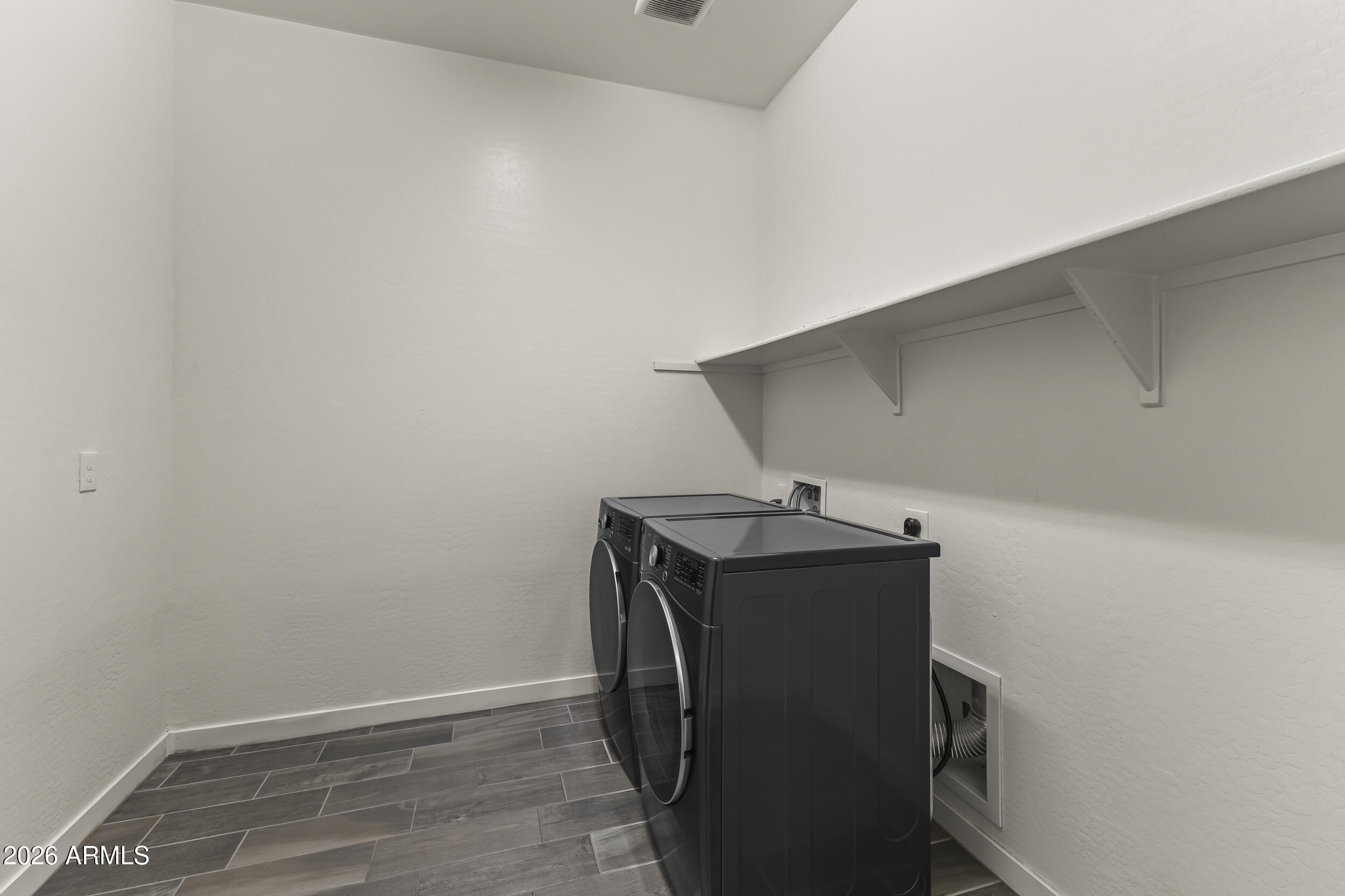 5255 North Ginning Road Litchfield Park, AZ 85340 - Photo 30 of 60 a utility room with dryer and washer