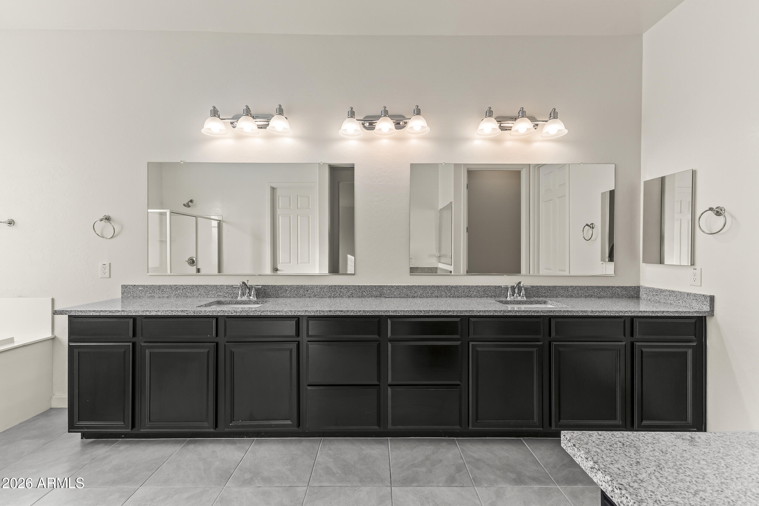5255 North Ginning Road Litchfield Park, AZ 85340 - Photo 33 of 60 a bathroom with a sink and mirror