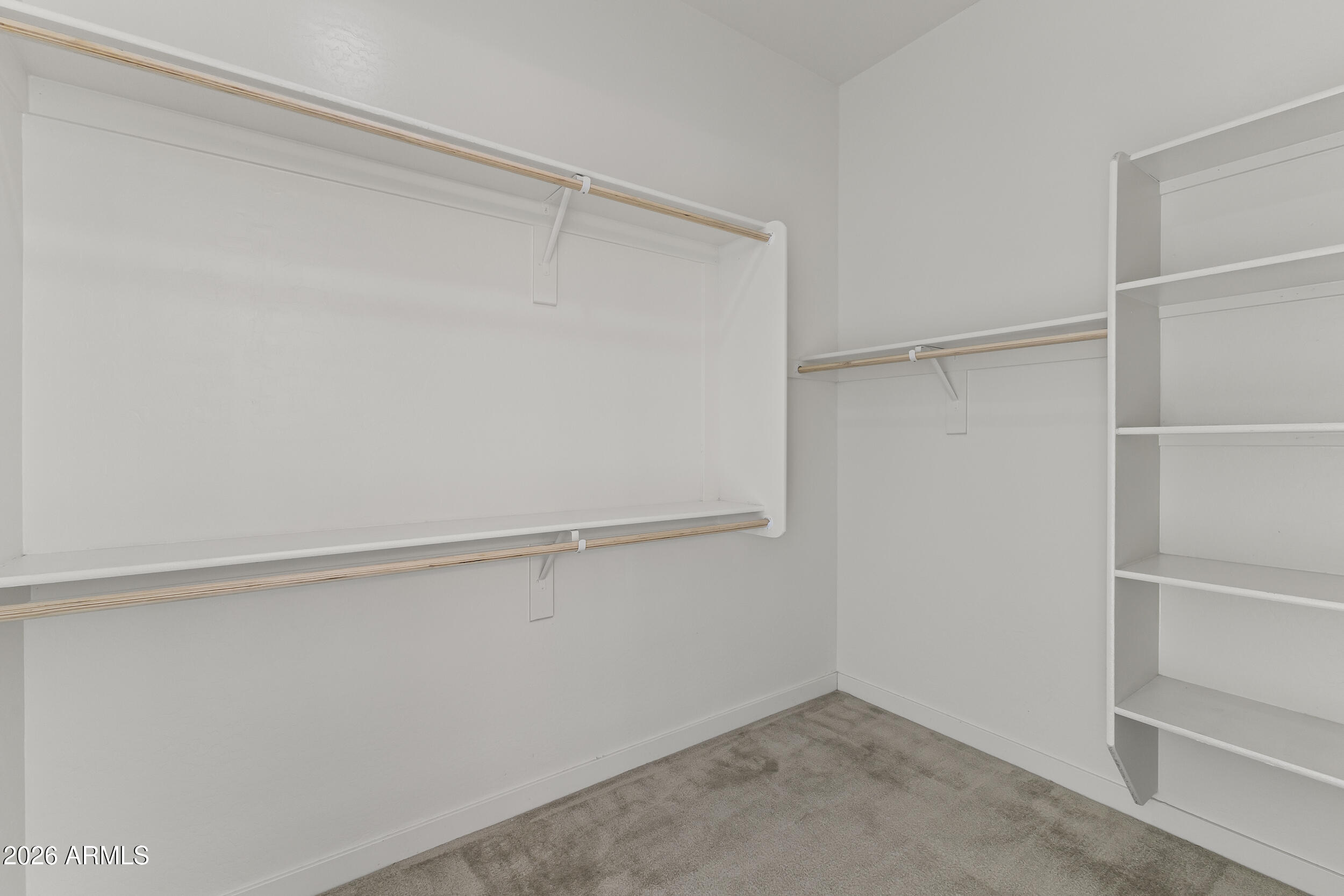 5255 North Ginning Road Litchfield Park, AZ 85340 - Photo 34 of 60 a view of an empty walk in closet