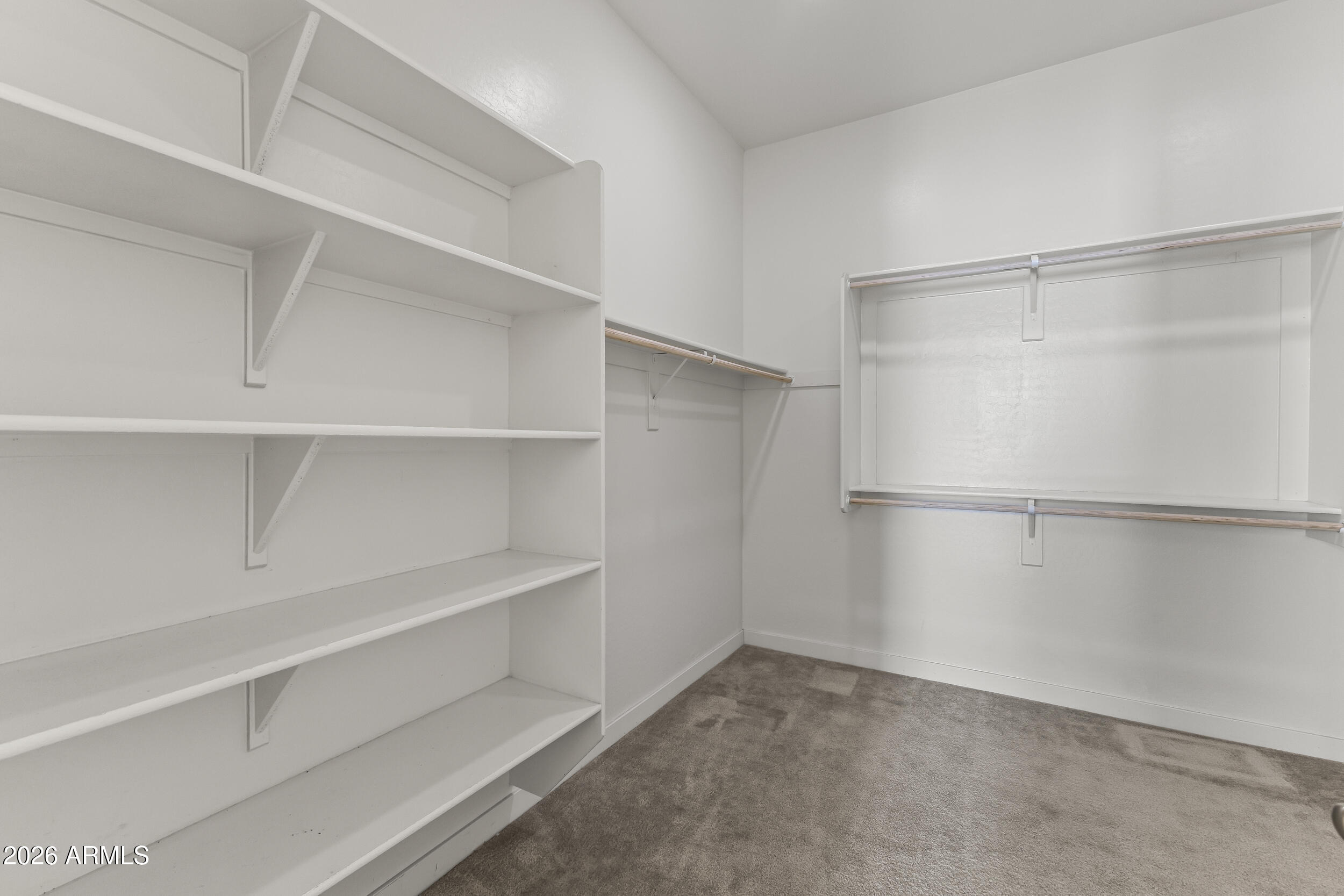 5255 North Ginning Road Litchfield Park, AZ 85340 - Photo 35 of 60 a view of an empty walk in closet