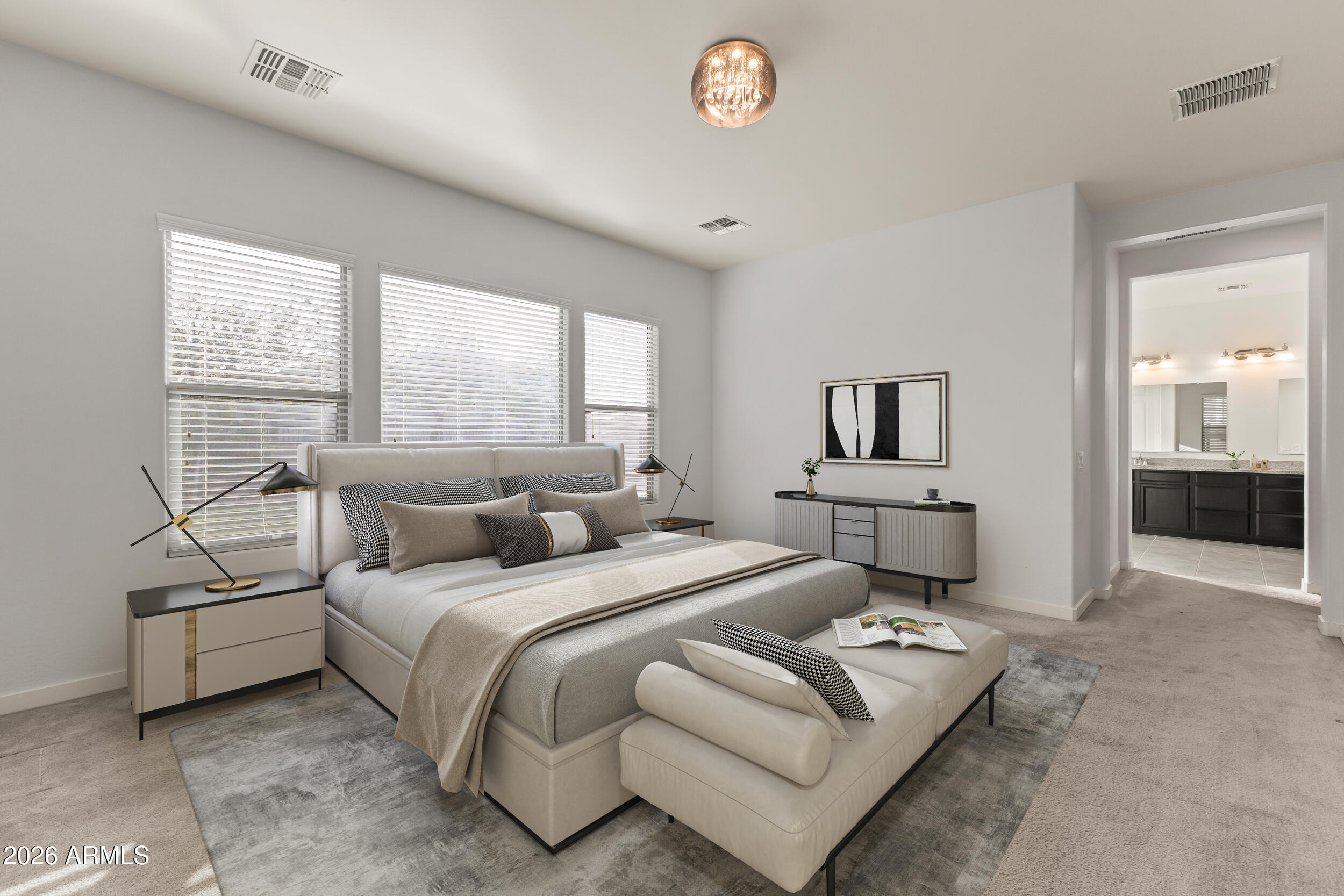 5255 North Ginning Road Litchfield Park, AZ 85340 - Photo 37 of 60 a bedroom with a bed and a chandelier