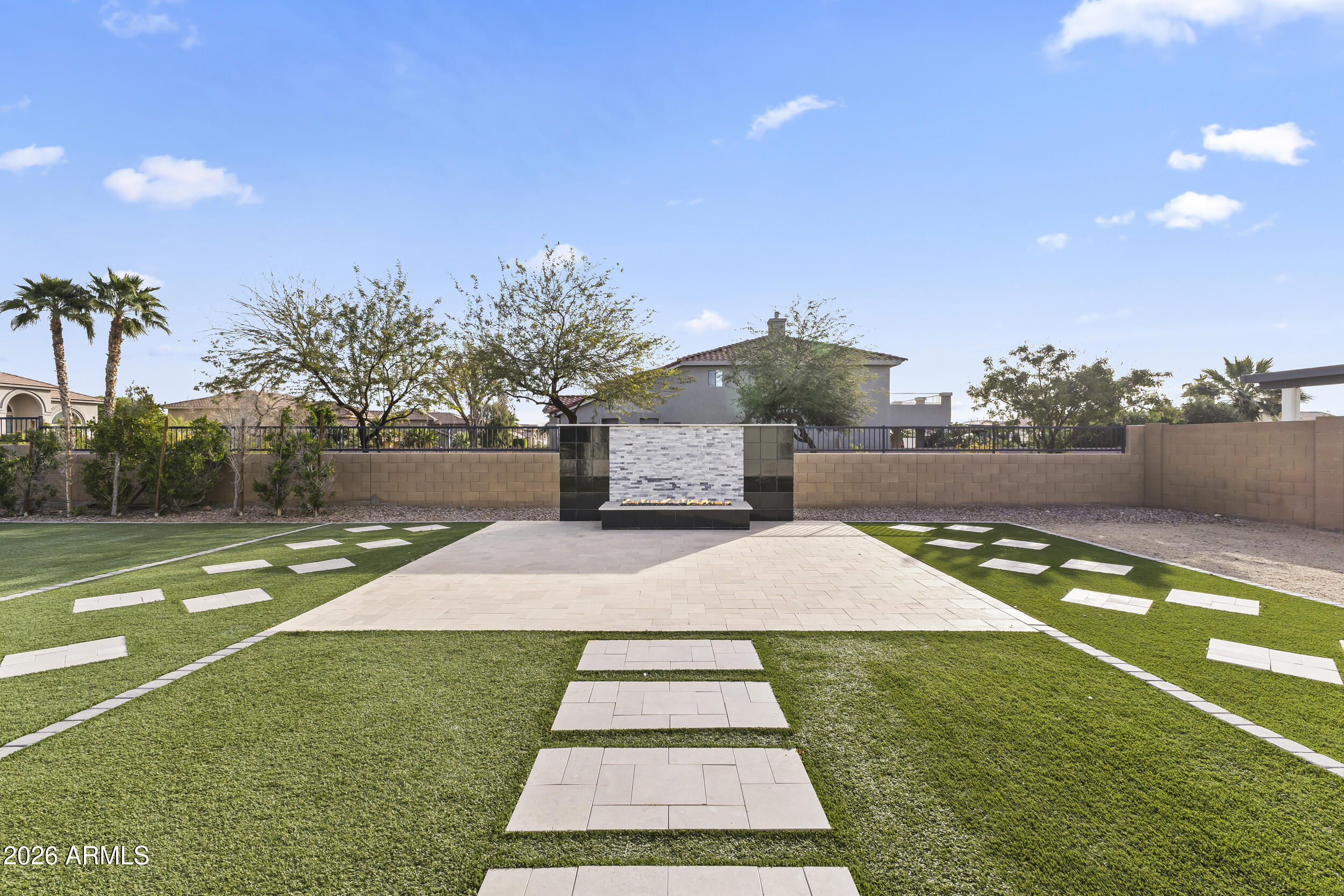 5255 North Ginning Road Litchfield Park, AZ 85340 - Photo 46 of 60 a front view of a house with a yard