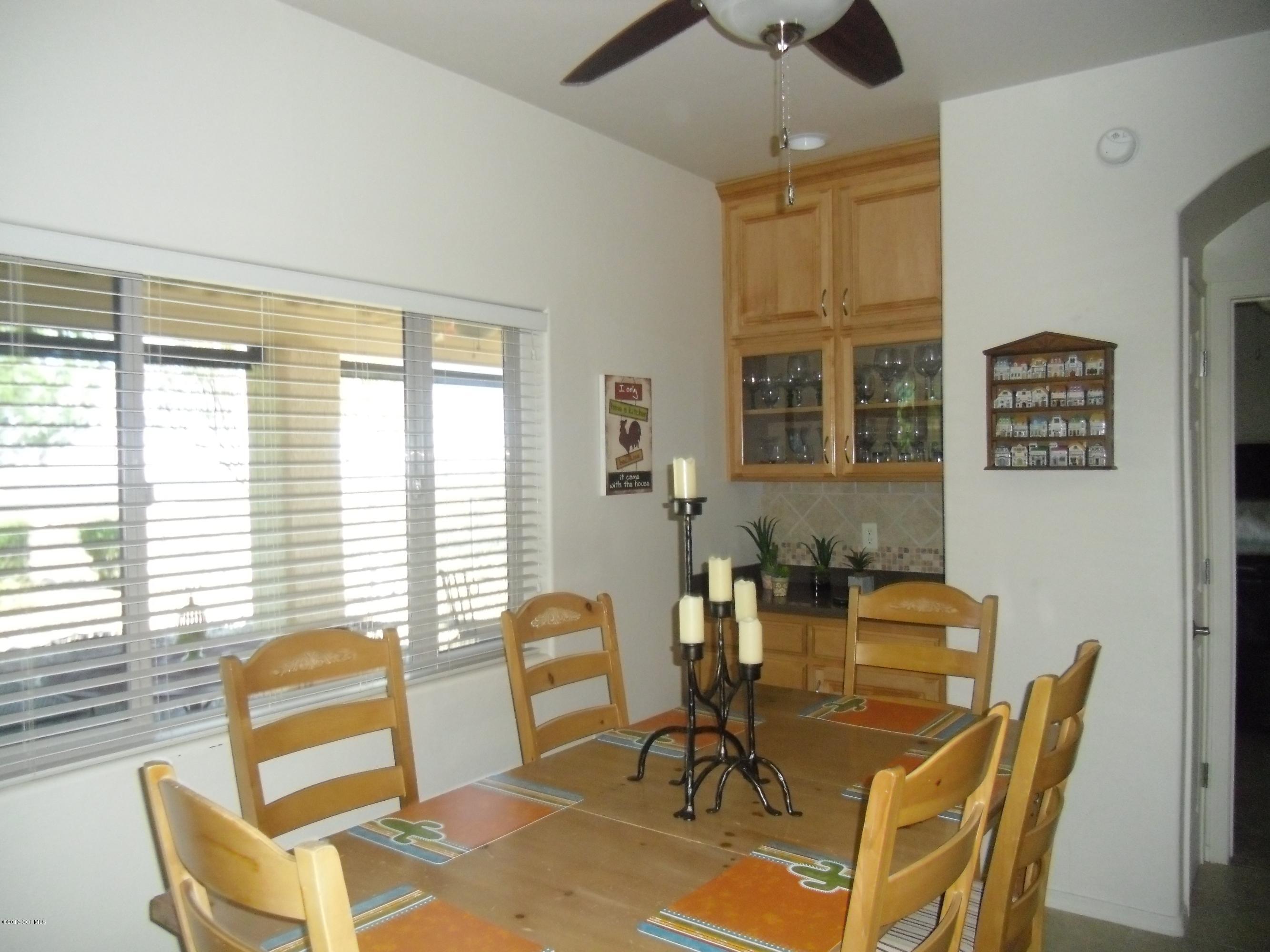 942 Via Puebla Rio Rico, AZ 85648 - Photo 32 of 73 a view of a dining room with furniture and windows