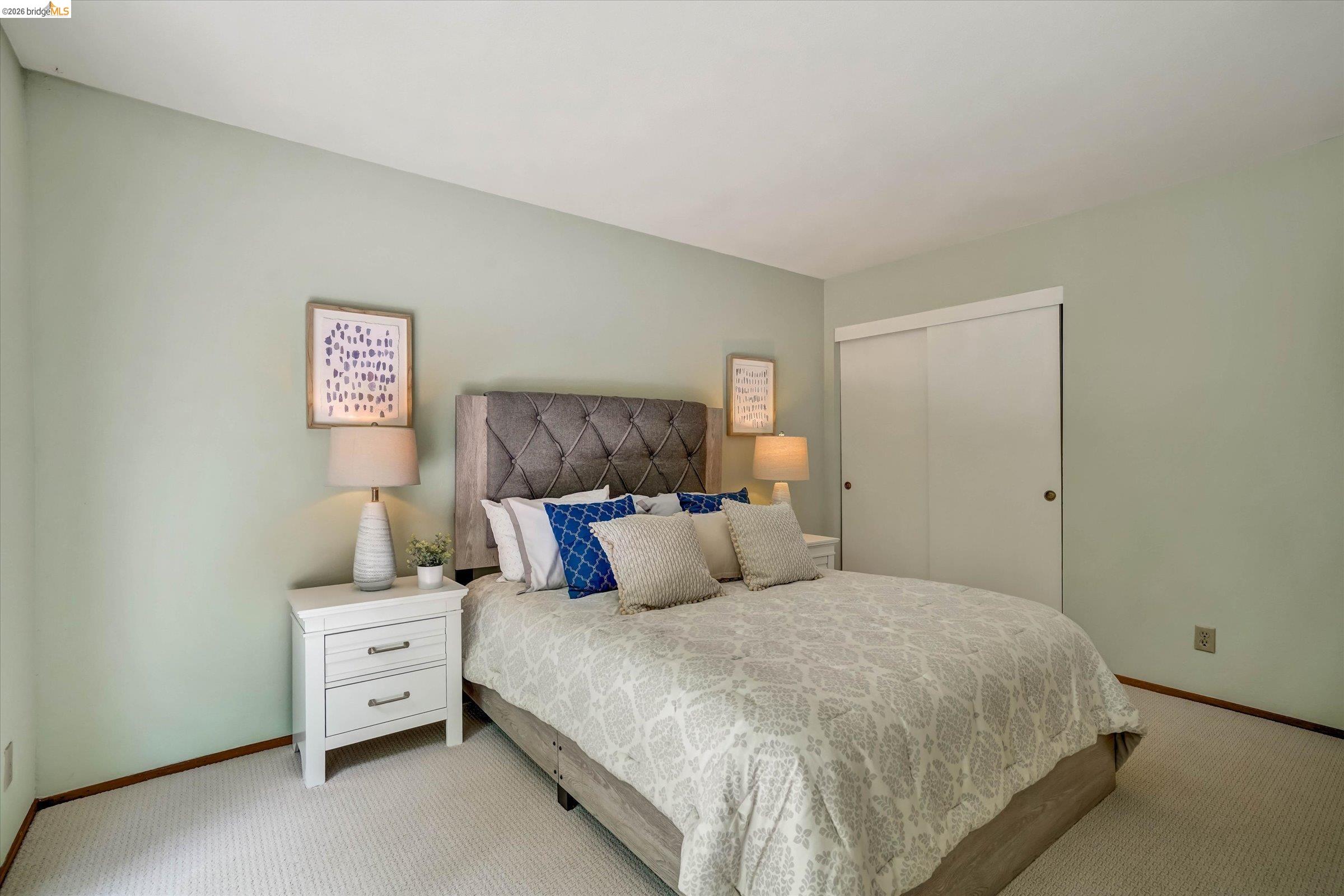 2826 Wright Avenue Pinole, CA 94564 - Photo 29 of 70 Room featuring light green wall paint, wall-to-wall carpeting, and a built-in sliding closet