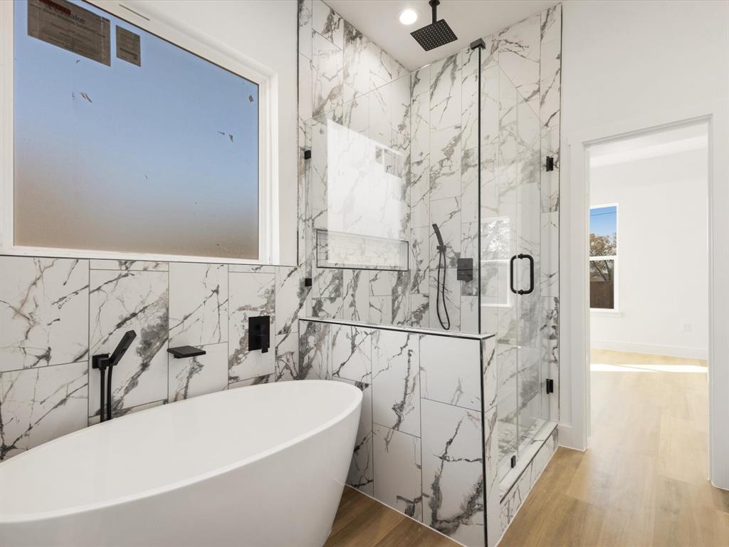 111 West Farmers Road Seagoville, TX 75159 - Photo 14 of 32 a bathroom with a bathtub and shower