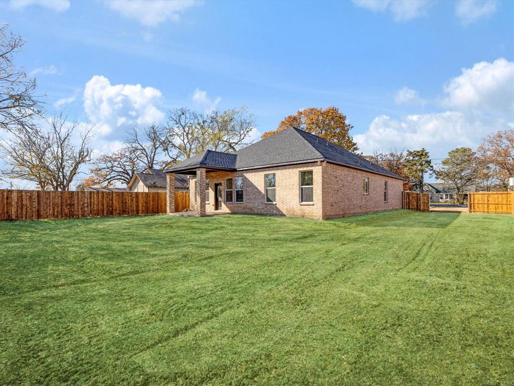 111 West Farmers Road Seagoville, TX 75159 - Photo 23 of 32 a front view of a house with garden