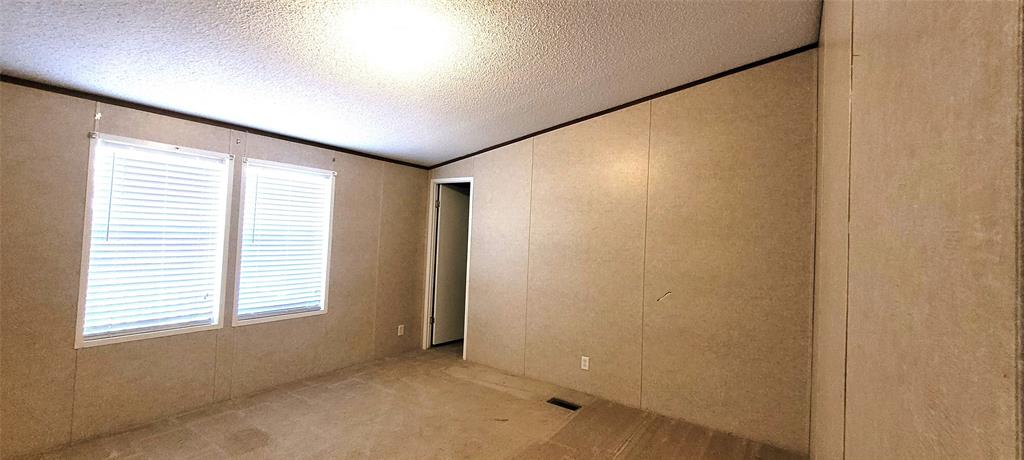 5543 Upper Denton Road Weatherford, TX 76085 - Photo 12 of 23 a view of an empty room with a window