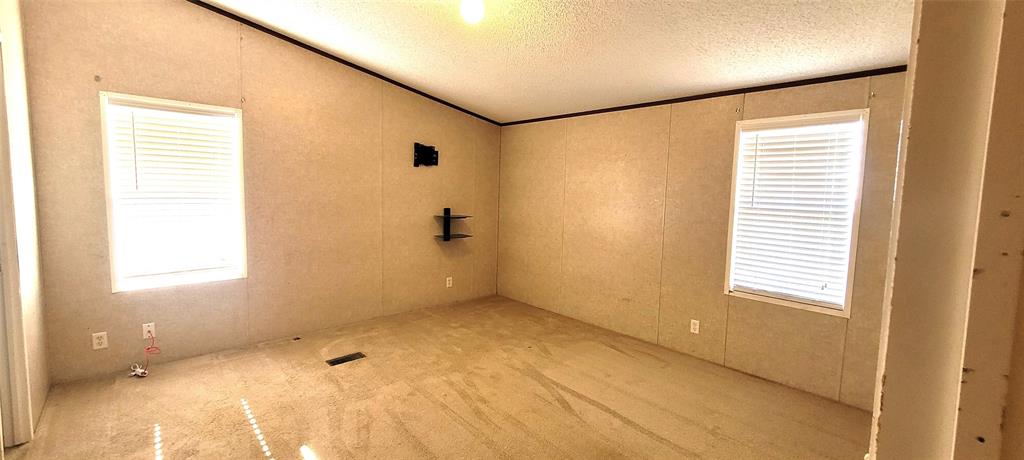 5543 Upper Denton Road Weatherford, TX 76085 - Photo 13 of 23 a view of an empty room with a window