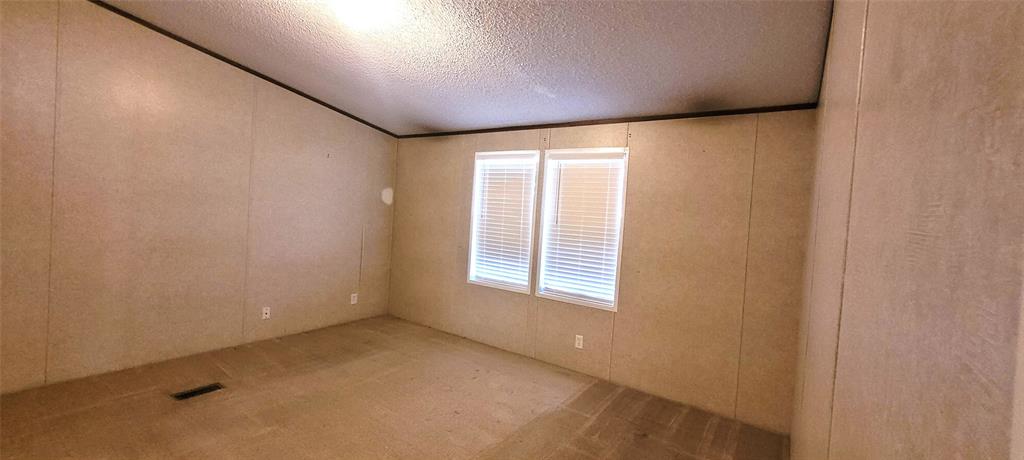 5543 Upper Denton Road Weatherford, TX 76085 - Photo 15 of 23 an empty room with a window