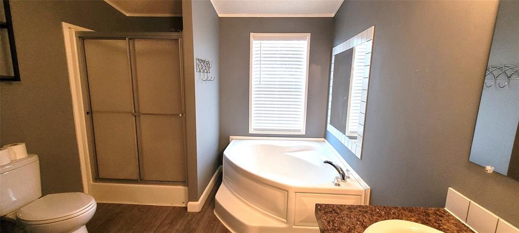 5543 Upper Denton Road Weatherford, TX 76085 - Photo 18 of 23 a bathroom with a sink toilet and shower