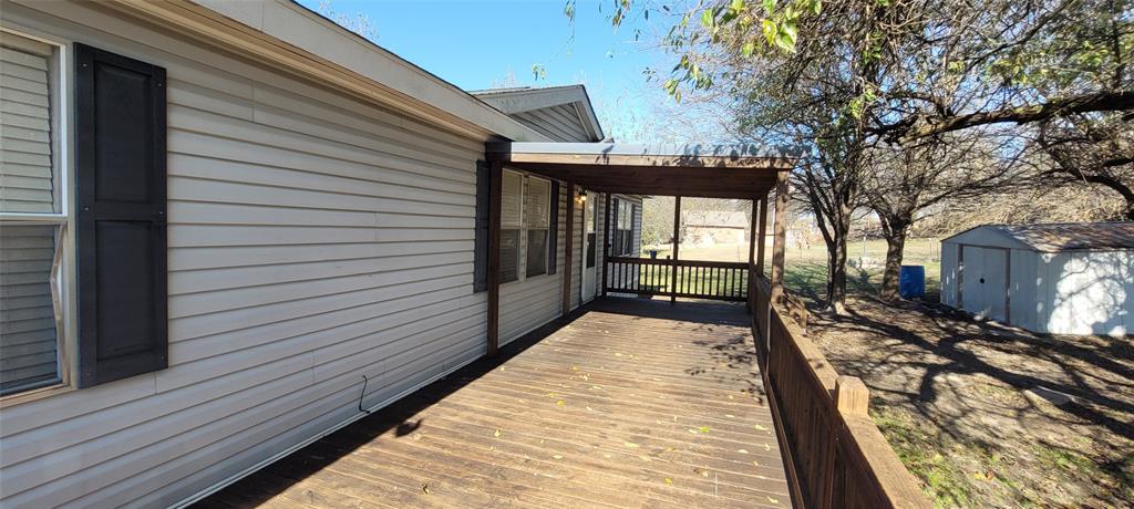 5543 Upper Denton Road Weatherford, TX 76085 - Photo 2 of 23 a view of a balcony with wooden floor