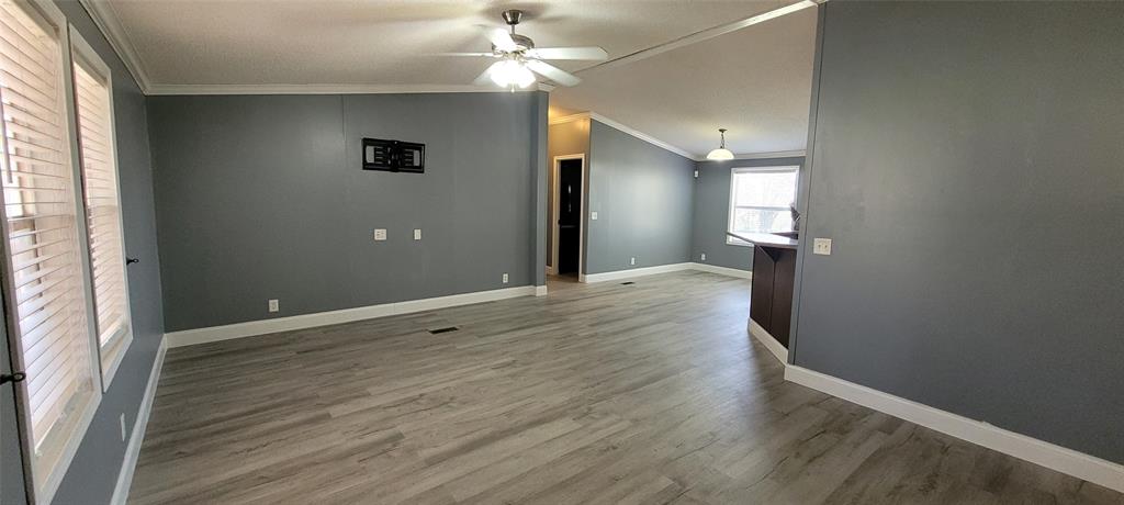 5543 Upper Denton Road Weatherford, TX 76085 - Photo 20 of 23 an empty room with wooden floor and windows