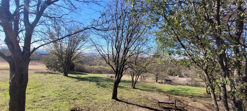 5543 Upper Denton Road Weatherford, TX 76085 - Photo 21 of 23 a view of a yard with large trees