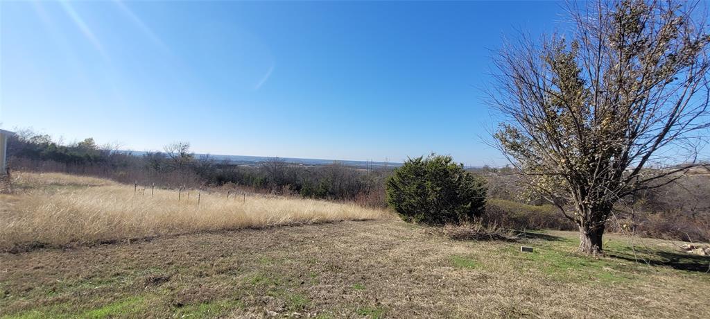 5543 Upper Denton Road Weatherford, TX 76085 - Photo 5 of 23 a view of a lake with a yard