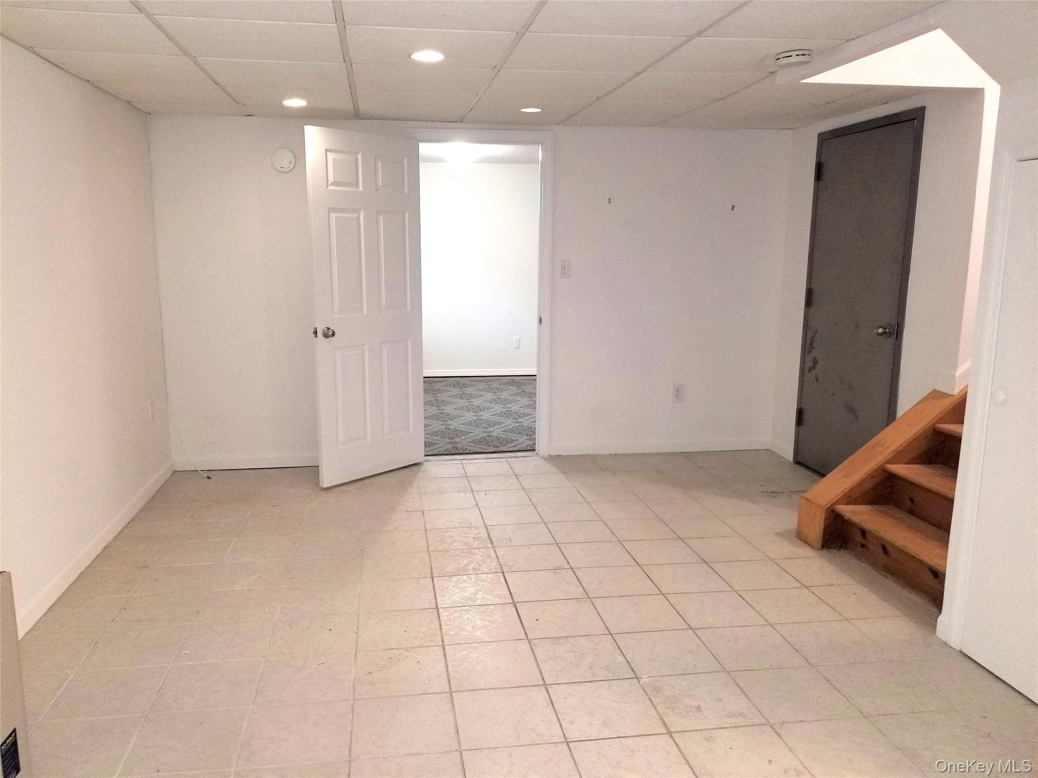 70 Hickory Road, Unit B Port Washington, NY 11050 - Photo 15 of 18 a view of a room with gym equipment