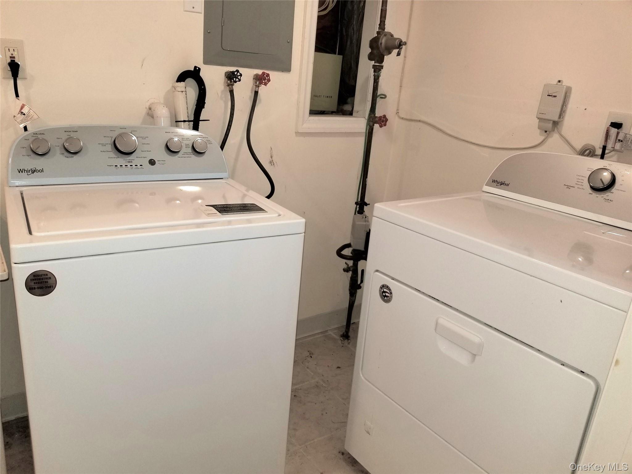 70 Hickory Road, Unit B Port Washington, NY 11050 - Photo 16 of 18 a utility room with dryer and washer