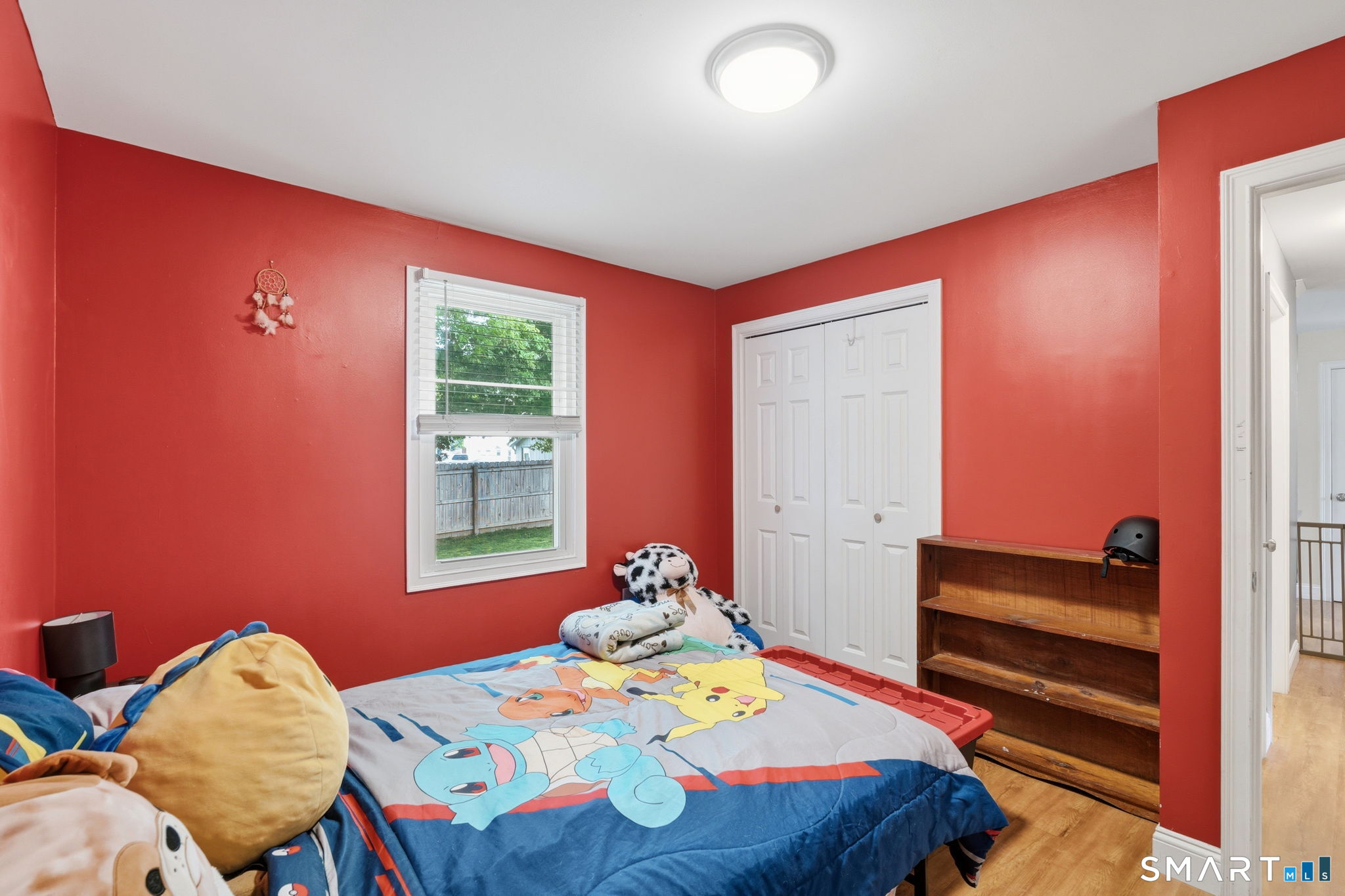 71 Smith Street Putnam, CT 06260 - Photo 6 of 25 a bedroom with a bed and a window