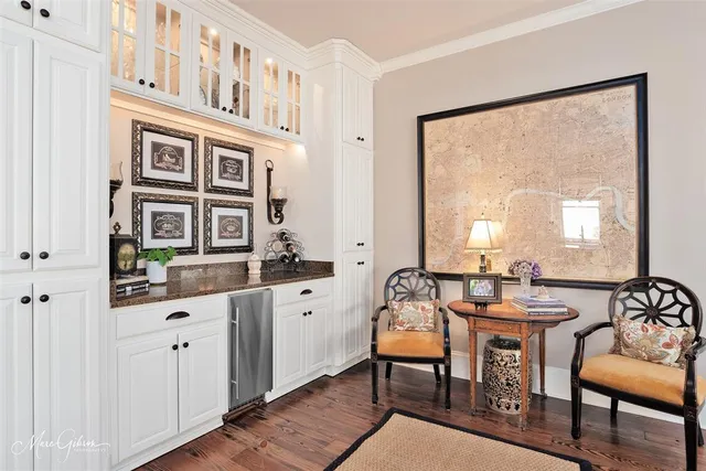 a view of a a dining room with furniture window and wooden floor