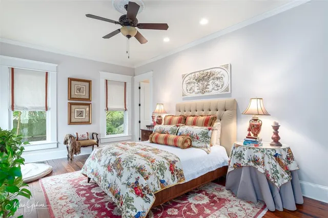 a bedroom with bed and a chandelier