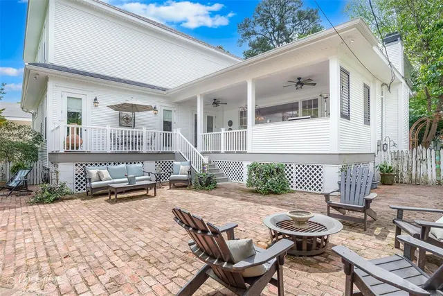 a view of a patio with table and chairs and potted plants