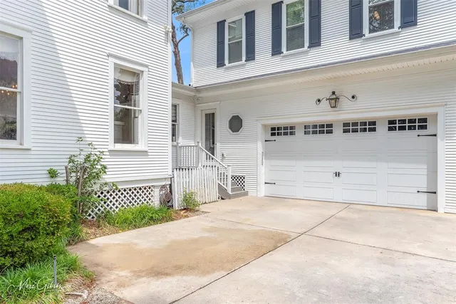 a front view of a house with a garage