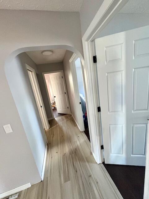 1142 Southwest Bayamo Avenue Port St. Lucie, FL 34953 - Photo 12 of 19 a view of a hallway with wooden floor and staircase