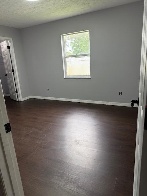 1142 Southwest Bayamo Avenue Port St. Lucie, FL 34953 - Photo 13 of 19 an empty room with wooden floor and windows