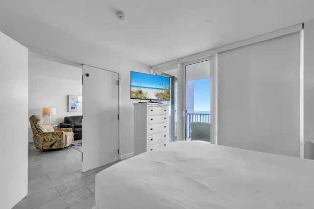 a bedroom with a bed and a view of bedroom