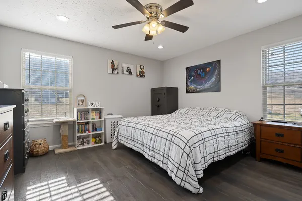 a bedroom with a bed and a chandelier