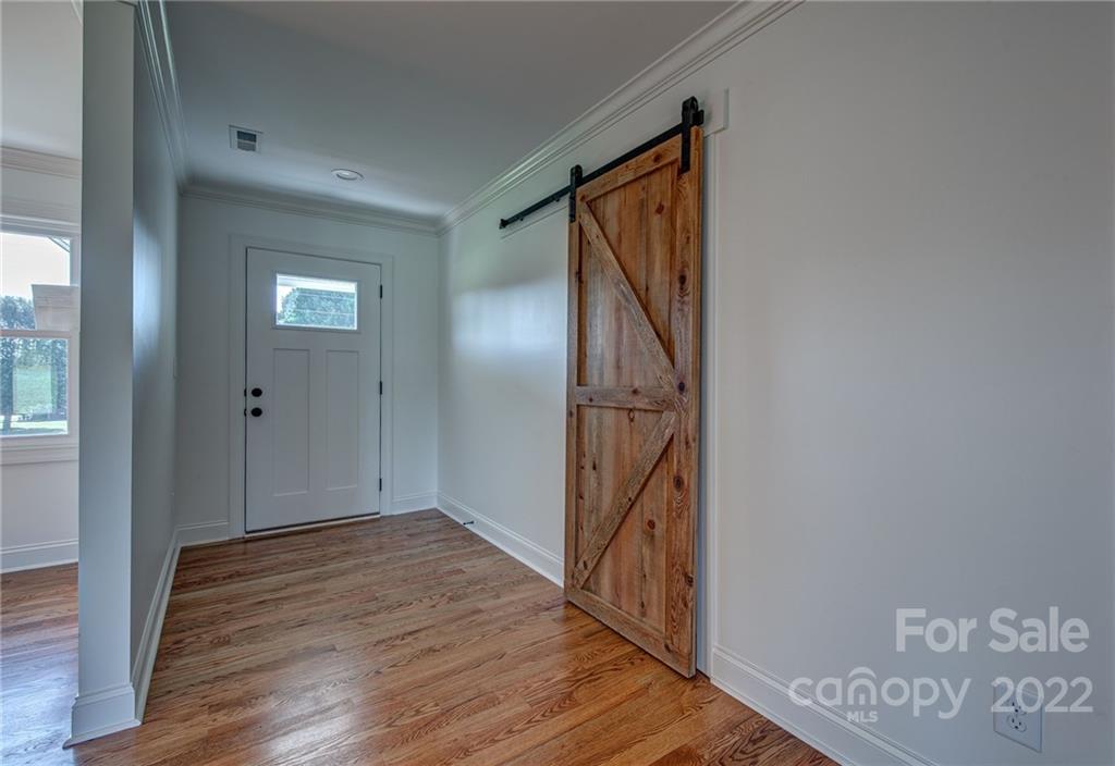 649 Loray Farm Road Dallas, NC 28034 - Photo 12 of 44 a view of a hallway with wooden floor and entryway