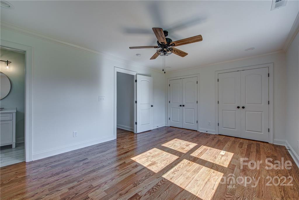 649 Loray Farm Road Dallas, NC 28034 - Photo 27 of 44 a view of empty room with wooden floor and fan