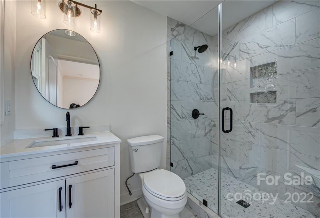 649 Loray Farm Road Dallas, NC 28034 - Photo 29 of 44 a bathroom with a sink toilet and a mirror