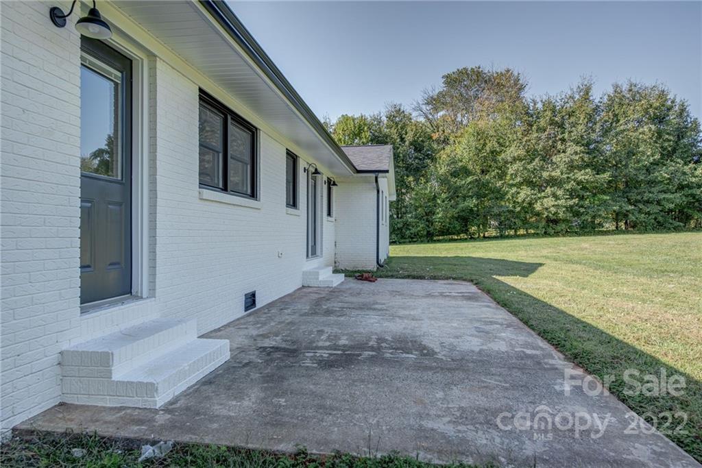 649 Loray Farm Road Dallas, NC 28034 - Photo 32 of 44 a view of a yard in front of a house
