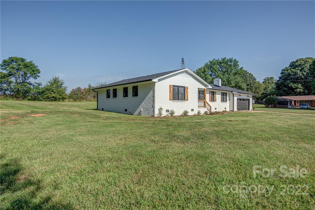 649 Loray Farm Road Dallas, NC 28034 - Photo 35 of 44 a view of a house with a yard