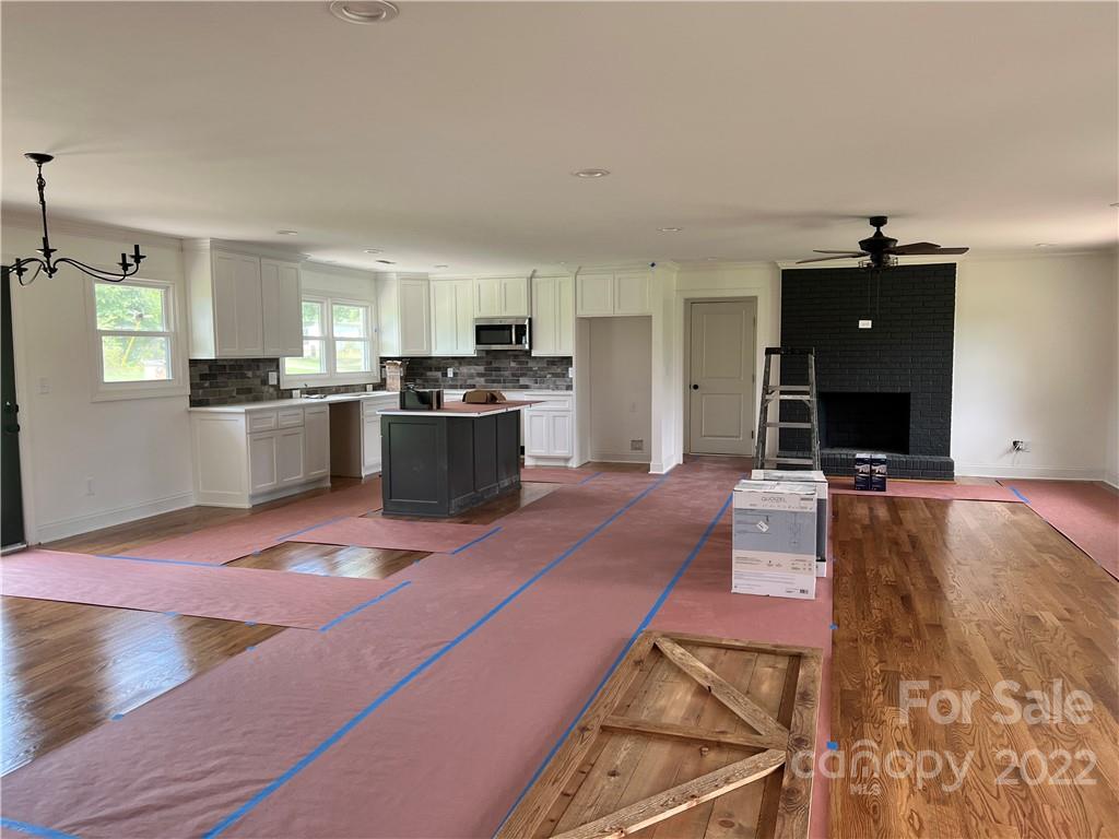 649 Loray Farm Road Dallas, NC 28034 - Photo 4 of 44 a living room with furniture and a flat screen tv