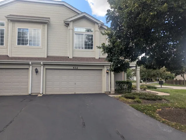 a view of garage and yard