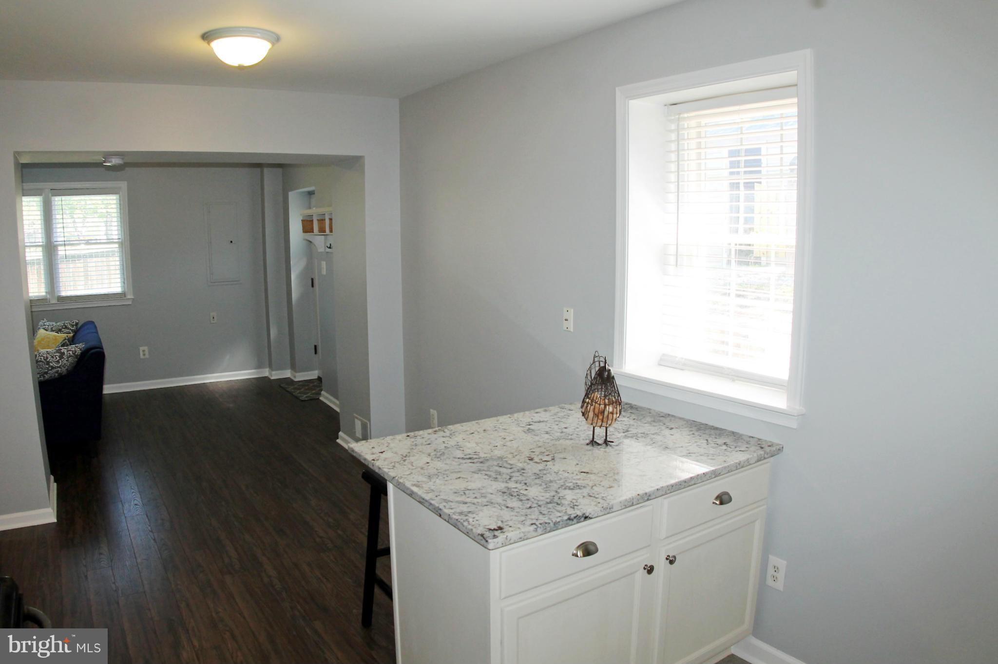 26722 Ridge Road Damascus, MD 20872 - Photo 12 of 30 a bathroom with a granite countertop sink toilet and a mirror