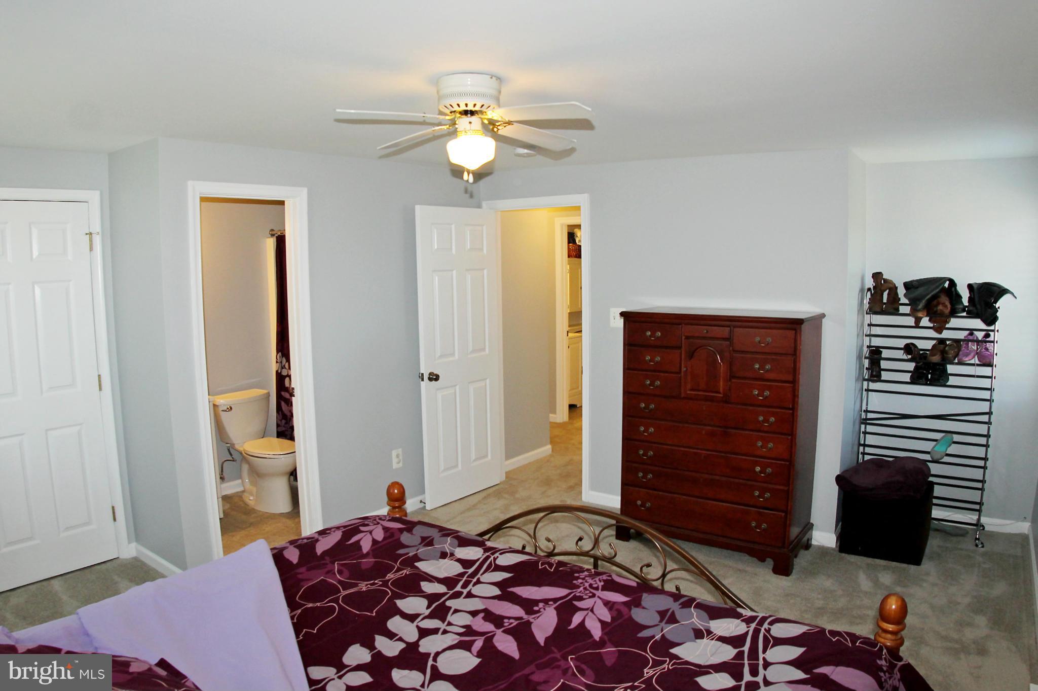 26722 Ridge Road Damascus, MD 20872 - Photo 16 of 30 a bedroom with a bed and cabinets