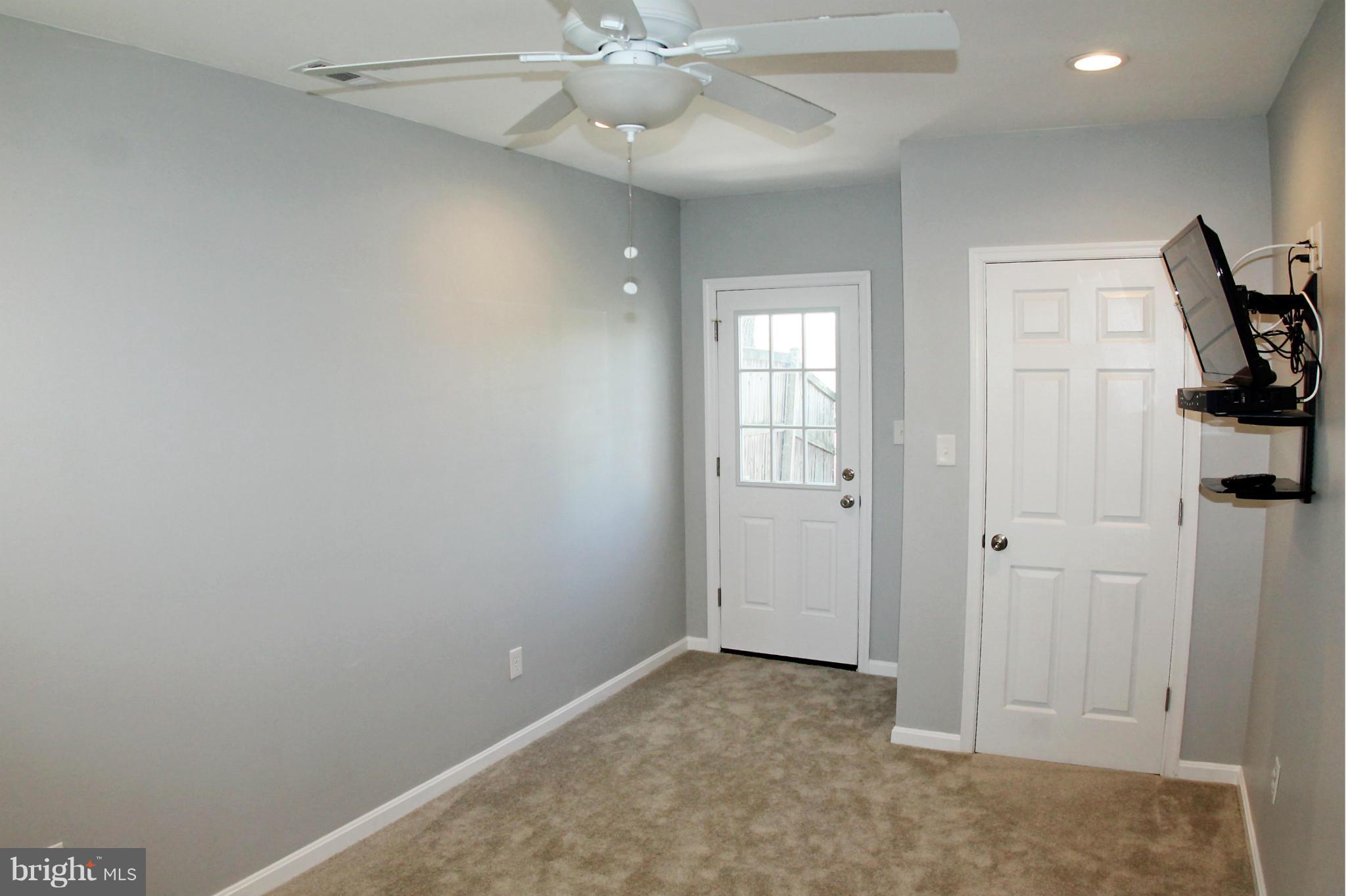 26722 Ridge Road Damascus, MD 20872 - Photo 24 of 30 an empty room with windows and fan
