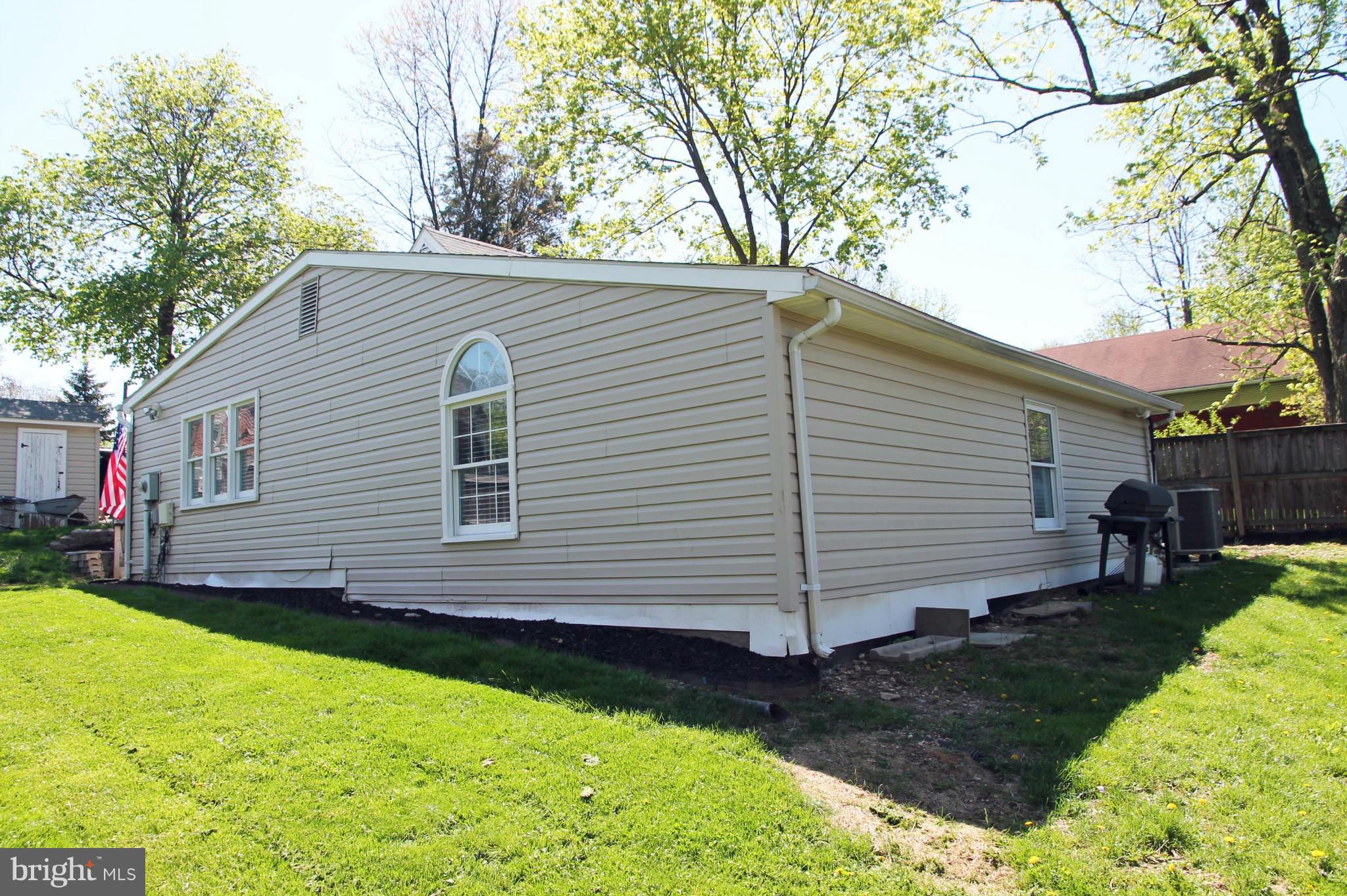 26722 Ridge Road Damascus, MD 20872 - Photo 29 of 30 a view of a house with a yard