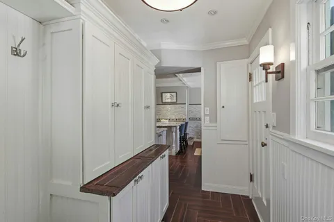 a view of a hallway with a hallway and a livingroom with furniture