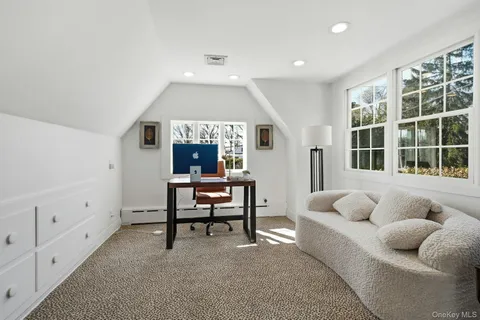 a living room with furniture and windows