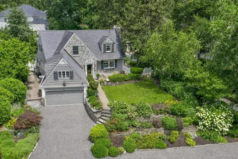 a aerial view of a house with a yard