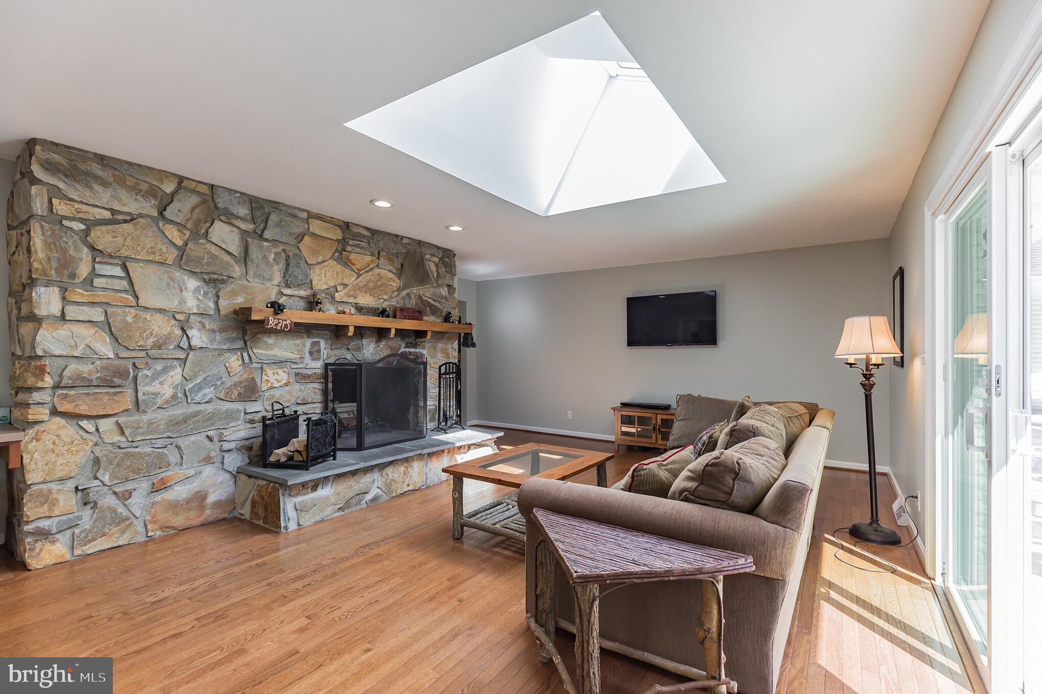 10311 3 Doctors Road Dunkirk, MD 20754 - Photo 14 of 31 Family Room with Large Fireplace & Skylight