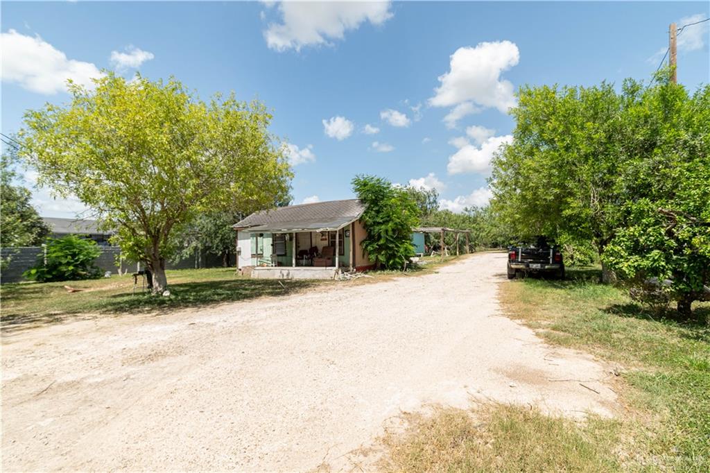 2713 South Midway Road Weslaco, TX 78596 - Photo 12 of 17 a view of a house with a yard and sitting area