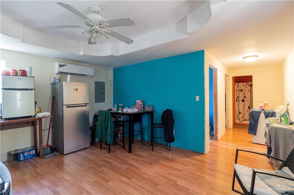 2713 South Midway Road Weslaco, TX 78596 - Photo 3 of 17 a view of a livingroom with furniture and a kitchen